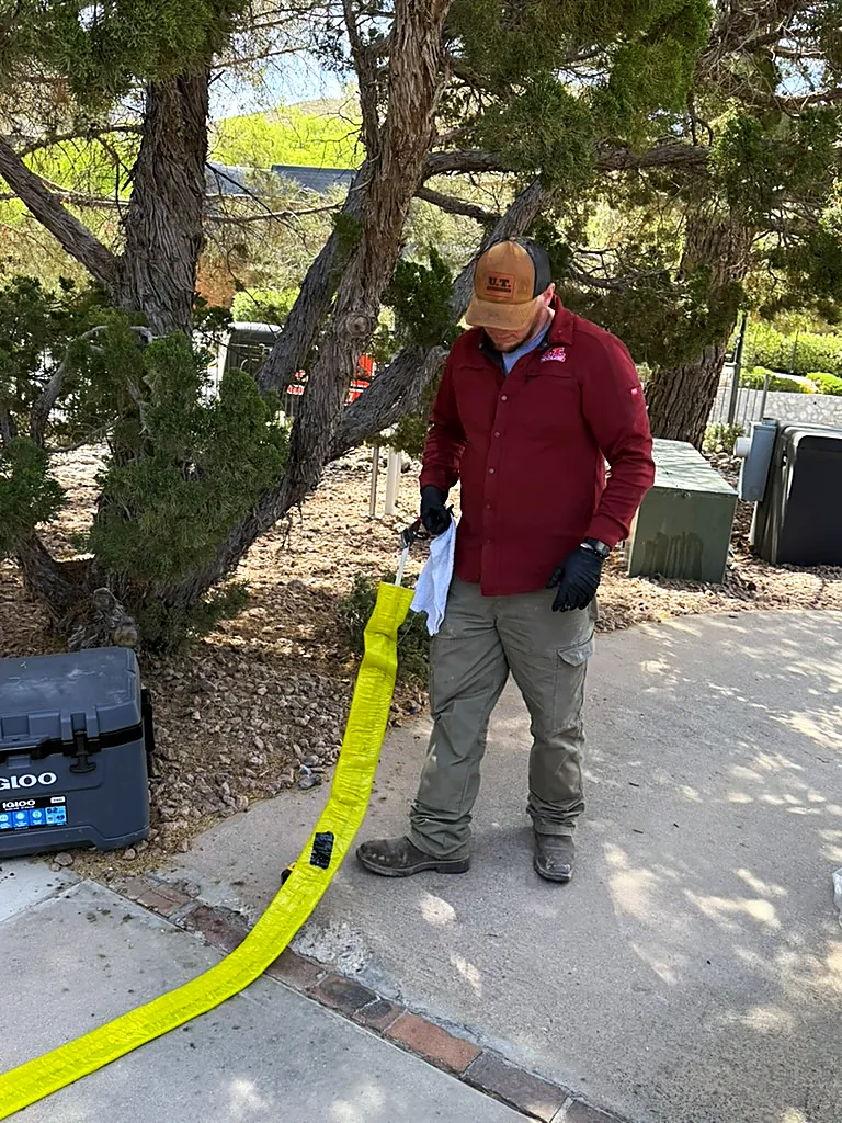 Technician preparing a CIPP pipe liner for trenchless sewer repair in El Paso