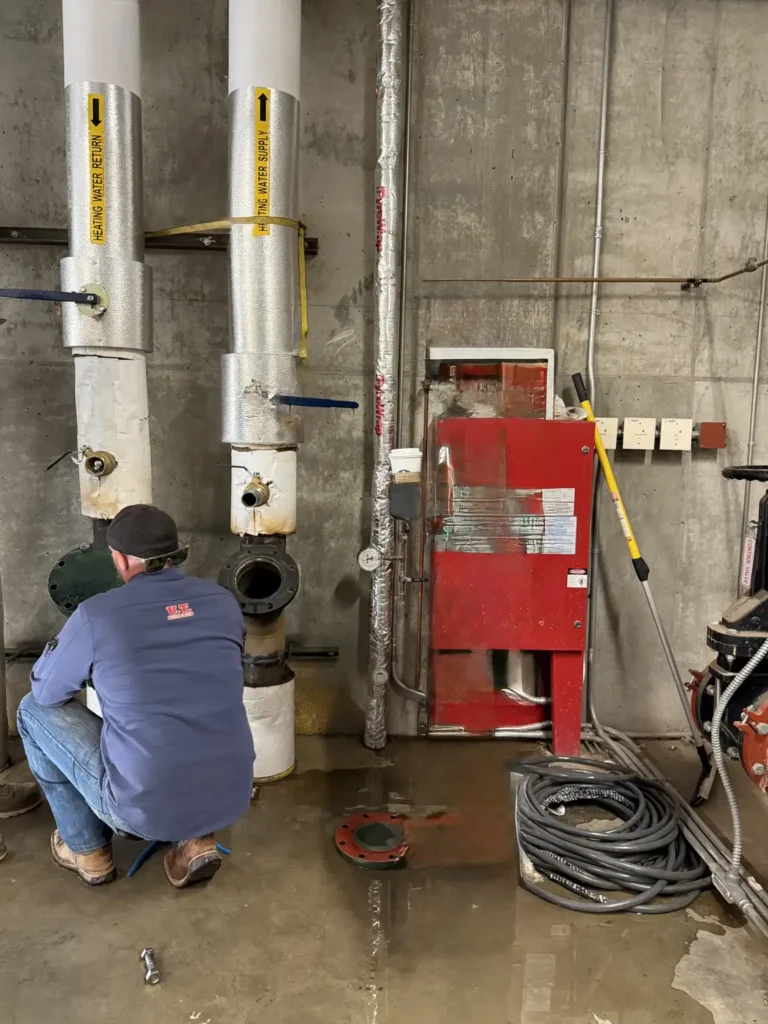 Medical facility plumbing work on commercial pipelines in a mechanical room in El Paso