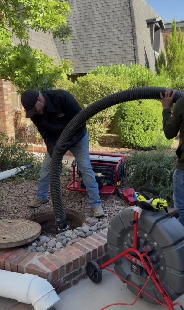 Lower Valley / Mission Valley 1 U.T. Trenchless technicians working a sewer cleanout with a camera reel at an El Paso property